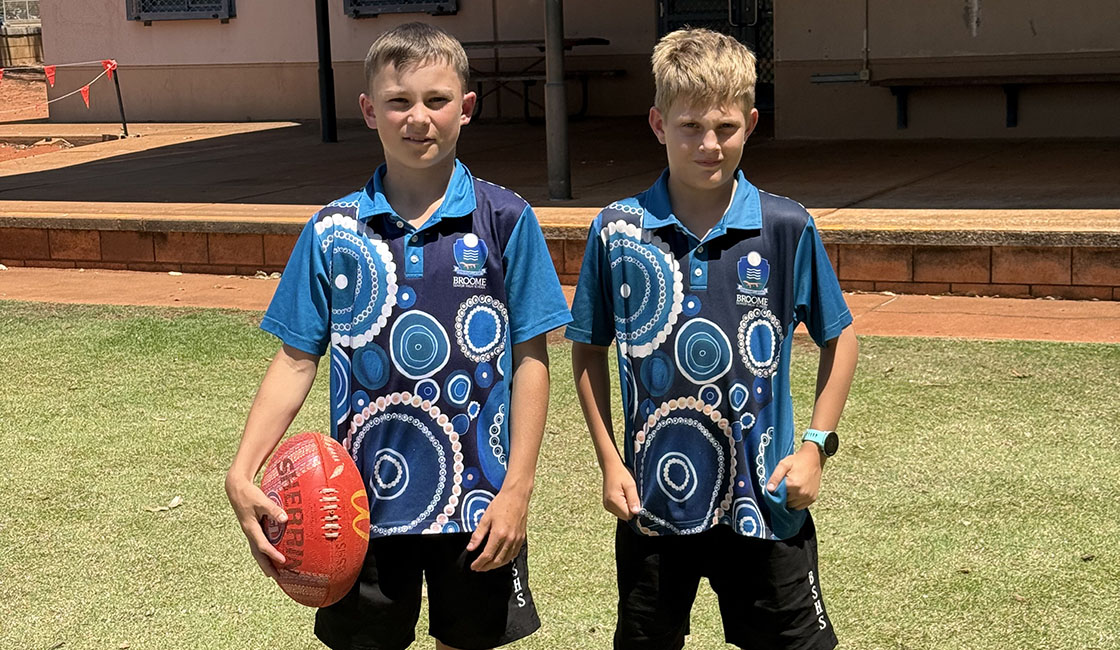 Sports Uniform Students looking through microscopes Banner